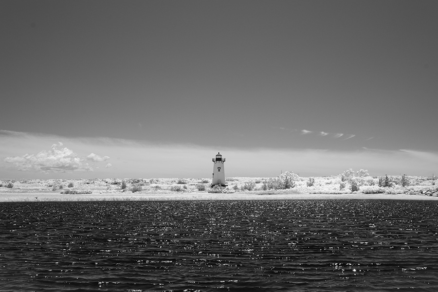 Infrared Photo of Water, Lighthouse and Sky.